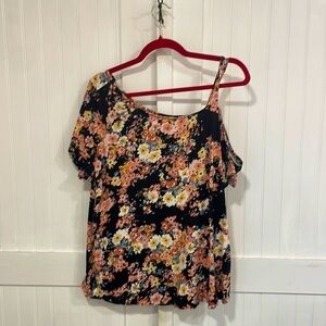 Maurice’s floral top (black, peach, yellow) with one open shoulder. Size OX